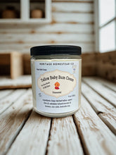 Load image into Gallery viewer, Jar of Tallow Baby Bum Cream from Heritage Homestead Co on a wooden surface