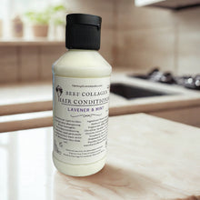 Load image into Gallery viewer, Bottle of beef collagen hair conditioner on a kitchen counter