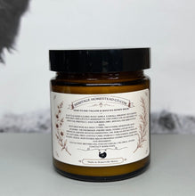 Load image into Gallery viewer, A jar of Heritage Homestead Cowl hair mask in an amber glass bottle with a black lid and a cream-colored label, set against a light gray background with a dark shadow on the upper left.