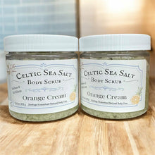 Load image into Gallery viewer, Two jars of Celtic Sea Salt Body Scrub with Orange Cream flavor on a wooden surface.