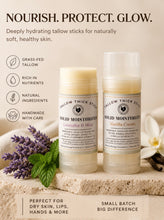 Load image into Gallery viewer, Two solid moisturizer sticks on a stone surface with lavender and mint leaves, surrounded by text about product benefits.