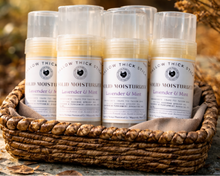 Load image into Gallery viewer, Tallow Thick Stick solid moisturizer bars in twist-up tubes, displayed in a rustic woven basket outdoors with warm autumn background; lavender & mint scent, natural tallow skincare, mess-free lotion bar for dry and sensitive skin.