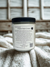 Load image into Gallery viewer, Jar of diaper rash cream with a label on a textured surface

