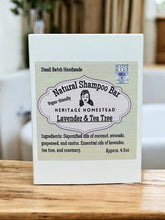 Load image into Gallery viewer, Heritage Homestead natural shampoo bar packaging on a wooden surface with a blurred background
