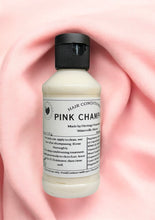 Load image into Gallery viewer, 4 oz Bottle of Pink Champagne scented bovine collagen hair conditioner on a pink fabric background
