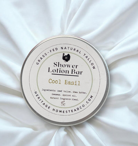 Shower Lotion Bar container with 'Cool Basil' scent on a white fabric background