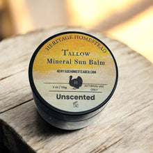 Load image into Gallery viewer, Tallow Mineral Sun Balm container on a wooden surface with a blurred background
