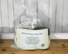 Load image into Gallery viewer, Tallow hand care set in clear packaging on a wooden surface with a gray wooden panel background
