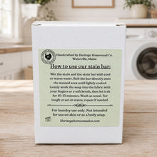 Load image into Gallery viewer, A white cardboard box for Heritage Homestead Co. stain bar, shown from the back with a printed instruction label.
