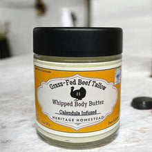 Load image into Gallery viewer, Jar of grass-fed beef tallow whipped body butter on a marble surface
