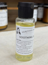 Load image into Gallery viewer, Bottle of Heritage Soothing Scalp Oil on a textured surface. 
natural scalp treatment
dry scalp remedy
itchy scalp relief

