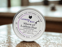 Load image into Gallery viewer, Lavender &amp; Mint Shower Lotion Bar on a wooden surface
