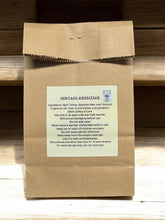 Load image into Gallery viewer, Kraft paper package with a label on a wooden surface
